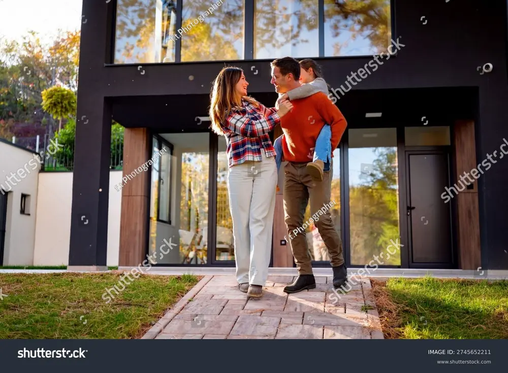 Couple outside their home